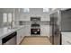 Bright kitchen with white cabinets, stainless steel appliances, and tile backsplash at 2721 Faiss Dr, Las Vegas, NV 89134