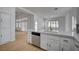 Open kitchen area featuring a large countertop with stainless steel dishwasher and undermount sink at 2721 Faiss Dr, Las Vegas, NV 89134