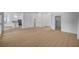 Large living room with wood flooring, white walls, and an open view into the kitchen at 2721 Faiss Dr, Las Vegas, NV 89134