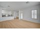 Open floor plan with wood floors, large windows and a view of the kitchen at 2721 Faiss Dr, Las Vegas, NV 89134