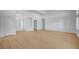 Spacious living room with white walls, wood floors, and a view of the front entrance at 2721 Faiss Dr, Las Vegas, NV 89134