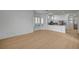 Open floor plan with wood floors and kitchen view at 2721 Faiss Dr, Las Vegas, NV 89134