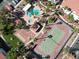 Aerial view showcasing community pool, clubhouse, tennis court, and putting green at 2725 S Nellis Blvd # 1052, Las Vegas, NV 89121