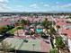 Community aerial view featuring a pool, tennis court, palm trees, and views of the city skyline and mountains at 2725 S Nellis Blvd # 1052, Las Vegas, NV 89121