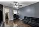 Bedroom featuring hardwood floors, dark paint, a ceiling fan, and a large window at 2725 S Nellis Blvd # 1052, Las Vegas, NV 89121