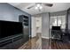 Bedroom featuring wood floors, a ceiling fan, a closet, and a dark shelving unit at 2725 S Nellis Blvd # 1052, Las Vegas, NV 89121