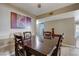 Traditional dining room with hardwood floors, a ceiling fan, and a large painting at 2725 S Nellis Blvd # 1052, Las Vegas, NV 89121