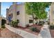 Inviting condo exterior featuring well-maintained landscaping and charming architectural details at 2725 S Nellis Blvd # 1052, Las Vegas, NV 89121