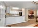 Bright kitchen featuring white cabinets, a breakfast bar and modern appliances at 2725 S Nellis Blvd # 1052, Las Vegas, NV 89121