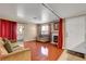 Comfortable living room with wood flooring, bright window, and a fireplace at 2725 S Nellis Blvd # 1052, Las Vegas, NV 89121