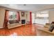 Living room with hardwood flooring, fireplace, with view of kitchen through doorframe at 2725 S Nellis Blvd # 1052, Las Vegas, NV 89121