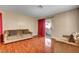 Open living area showcasing stylish decor, hardwood flooring and balcony access at 2725 S Nellis Blvd # 1052, Las Vegas, NV 89121