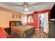 Main bedroom showcasing wood floors and a dark furniture set against red accent walls at 2725 S Nellis Blvd # 1052, Las Vegas, NV 89121