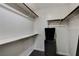 Walk-in closet with white walls, shelving, and a dark-colored laundry basket at 2725 S Nellis Blvd # 1052, Las Vegas, NV 89121