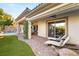 Inviting backyard with lounge chairs, manicured lawn, covered patio, and a sparkling pool at 28 Tea Olive Dr, Las Vegas, NV 89141
