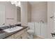Bathroom featuring accessible walk-in tub, tile floors, and vanity with dark countertop at 28 Tea Olive Dr, Las Vegas, NV 89141