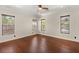 Unfurnished bedroom with hardwood floors, recessed lights, ceiling fan, and bright windows at 28 Tea Olive Dr, Las Vegas, NV 89141