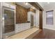 Butler's pantry with stone accent wall, wine cooler and custom cabinets at 28 Tea Olive Dr, Las Vegas, NV 89141