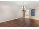 Elegant dining room featuring hardwood floors and a stylish chandelier at 28 Tea Olive Dr, Las Vegas, NV 89141