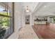 Hallway leading to a kitchen with an island and stainless steel appliances at 28 Tea Olive Dr, Las Vegas, NV 89141