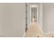 Hallway boasts tile floors with decorative inserts and freshly painted walls at 28 Tea Olive Dr, Las Vegas, NV 89141
