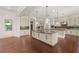 Bright kitchen with an island, stainless steel appliances, and wood flooring at 28 Tea Olive Dr, Las Vegas, NV 89141