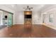 Large living space features hardwood floors, modern fireplace, recessed lighting, and seamless access to outdoor living areas at 28 Tea Olive Dr, Las Vegas, NV 89141