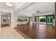 Expansive living area with an open layout, hardwood floors, and a seamless transition to the outdoor living space at 28 Tea Olive Dr, Las Vegas, NV 89141