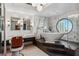 Upscale bathroom featuring a unique round window with city views, stylish fixtures and marble accents at 2857 Paradise Rd # 2203, Las Vegas, NV 89109