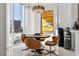 Bright dining area with floor-to-ceiling windows, modern lighting, and views of the city at 2857 Paradise Rd # 2203, Las Vegas, NV 89109