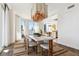 Elegant dining room with modern chandelier, city views, and seamless access to the kitchen at 2857 Paradise Rd # 2203, Las Vegas, NV 89109
