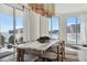Bright dining room with floor-to-ceiling windows, a long table, and balcony access at 2857 Paradise Rd # 2203, Las Vegas, NV 89109