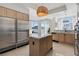 Modern kitchen featuring stainless steel appliances, marble countertops, and ample cabinet space at 2857 Paradise Rd # 2203, Las Vegas, NV 89109