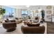 Large living room with a modern curved sofa, city views, and contemporary design at 2857 Paradise Rd # 2203, Las Vegas, NV 89109