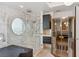 Luxurious shower with glass enclosure and round window offering stunning city views at 2857 Paradise Rd # 2203, Las Vegas, NV 89109
