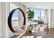 Modern sitting area with a hanging chair and views of the city skyline at 2857 Paradise Rd # 2203, Las Vegas, NV 89109