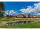 Backyard view of a pond and manicured golf course in a desert setting under a sunny sky at 2937 Billy Casper Dr, Las Vegas, NV 89134