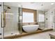 Luxurious bathroom with a freestanding tub, dual glass showers, and stylish tile work at 2937 Billy Casper Dr, Las Vegas, NV 89134
