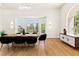 Bright dining room featuring large windows, modern lighting and wood flooring at 2937 Billy Casper Dr, Las Vegas, NV 89134