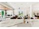 Gourmet kitchen with marble countertops, a modern fireplace, and views of the outdoors at 2937 Billy Casper Dr, Las Vegas, NV 89134