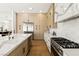 Modern kitchen boasts stainless appliances, marble counters, and custom cabinets at 2937 Billy Casper Dr, Las Vegas, NV 89134