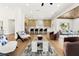 Open-concept living area features high ceilings, modern kitchen, and comfortable seating at 2937 Billy Casper Dr, Las Vegas, NV 89134
