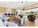 Expansive living room showcases golf course views, modern furniture and wood ceiling at 2937 Billy Casper Dr, Las Vegas, NV 89134
