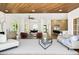 Spacious living room featuring modern decor, wood ceiling and open floor plan at 2937 Billy Casper Dr, Las Vegas, NV 89134