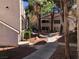Community landscaping with walkway featuring trees and residential buildings at 3041 Casey Dr # 101, Las Vegas, NV 89120
