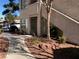 Charming condo exterior with beautiful landscaping and a well-maintained walkway at 3041 Casey Dr # 101, Las Vegas, NV 89120