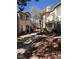 Exterior view of the community featuring walkways, trees, and residential buildings at 3041 Casey Dr # 101, Las Vegas, NV 89120