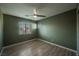 Bedroom features modern flooring, ceiling fan, and large windows at 3409 Catherine Mermet Ave, North Las Vegas, NV 89081