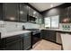 This open kitchen has updated stainless steel appliances, light counters and modern fixtures at 3409 Catherine Mermet Ave, North Las Vegas, NV 89081