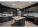 Modern kitchen features stainless steel appliances, granite counters and light wood grain flooring at 3409 Catherine Mermet Ave, North Las Vegas, NV 89081